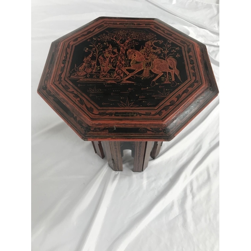 510 - BURMESE LACQUERED OCCASIONAL TABLE
with an hexagonal top decorated with a horse and figures, the fol... 