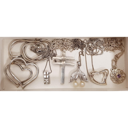 83 - SIX SILVER PENDANTS 
of various designs, including a pierced amethyst set pendants and heart shaped ... 