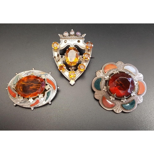 85 - THREE SCOTTISH GEM AND AGATE SET BROOCHES
of various designs, the stones including citrine, Cairngor... 