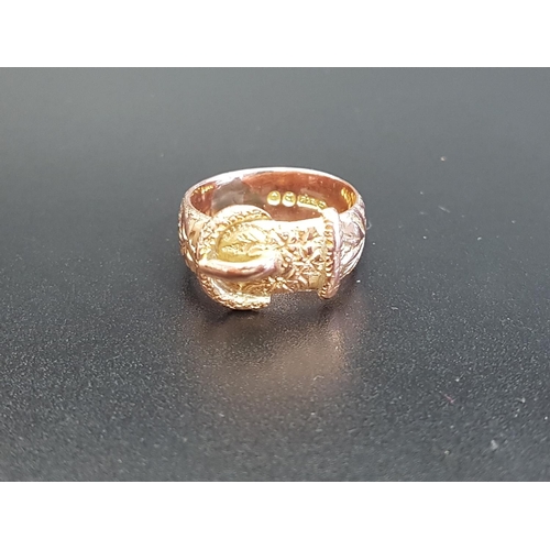 98 - NINE CARAT GOLD BUCKLE DESIGN RING
with engraved detail overall, ring size M-N and approximately 6.3... 