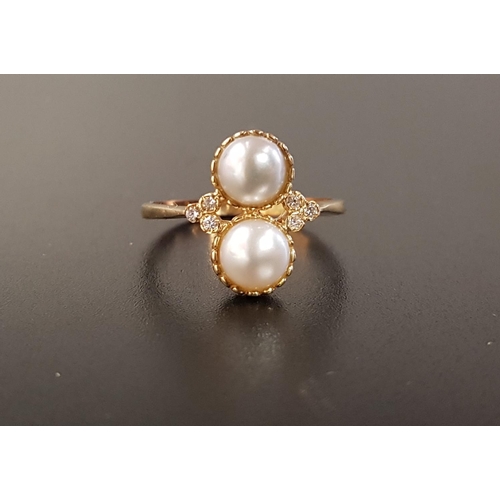 100 - UNUSUAL PEARL AND DIAMOND RING
the two vertically set cultured pearls flanked by three small diamond... 