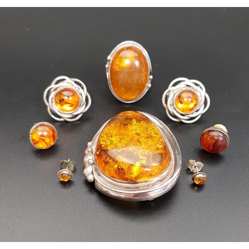 101 - SELECTION OF AMBER SET JEWELLERY
all set in silver, comprising a large brooch, a ring and three pair... 