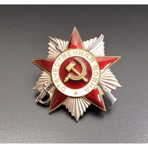 277 - WW II SOVIET RUSSIAN CAP BADGE
in white metal and red enamel, centered with the hammer and sickle, n... 