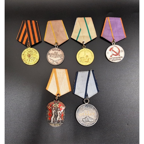 312 - SIX SOVIET RUSSIAN MEDALS
including the For Valour medal numbered 685927, Defence Of Leningrad medal... 