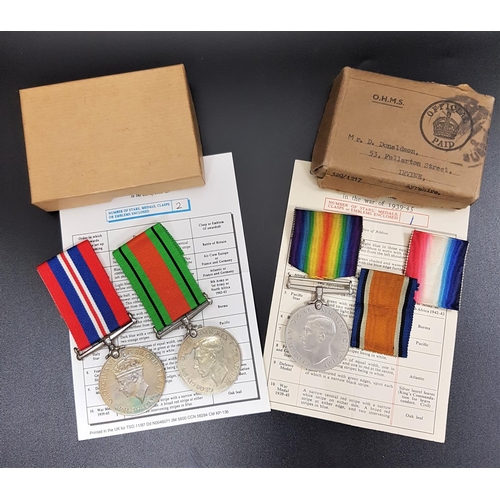 314 - THREE WWI MEDALS
including two Defence Medals and a War Medal, boxed