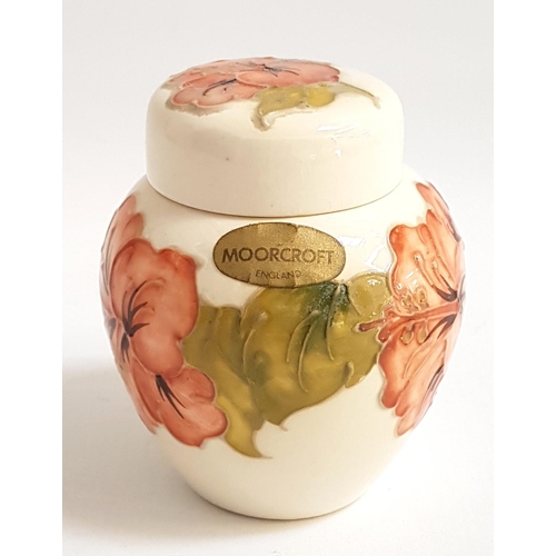 176 - MOORCROFT LIDDED GINGER JAR
decorated in the Hibiscus pattern with a cream ground, the base with imp... 