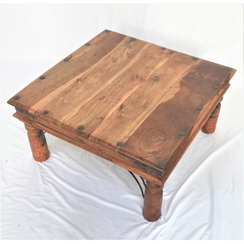 384 - TEAK OCCASIONAL TABLE
the square top with decorative stud detail, standing on bulbous turned support... 