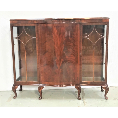 390 - MAHOGANY BOW FRONT DISPLAY CABINET
the moulded top above a central panelled door with a shelved inte... 