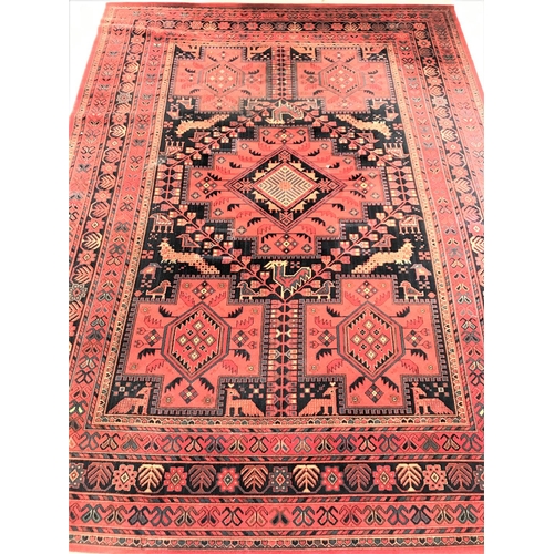 463 - LARGE MOSSOUL WOOL RUG
with a terracotta ground decorated with panels of animals and geometric motif... 