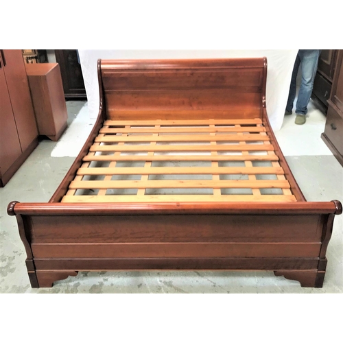 467 - CHERRY KING SIZE SLEIGH BED
with a slatted base, shaped roll top head and footboard