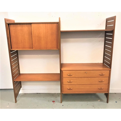 476 - 1970'S LADDERAX TEAK MODULAR WALL UNIT
comprising three ladder style uprights, a cupboard with a pai... 