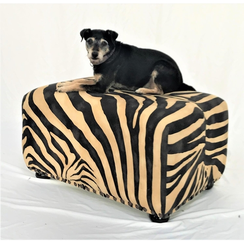 483 - LARGE FOOTSTOOL 
covered in a printed zebra skin fabric with decorative stud detail, standing on squ... 