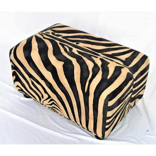 483 - LARGE FOOTSTOOL 
covered in a printed zebra skin fabric with decorative stud detail, standing on squ... 