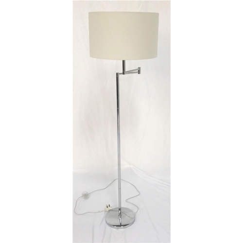 486 - ADJUSTABLE CHROME STANDARD LAMP
raised on a circular base with a tubular column to a two section adj... 