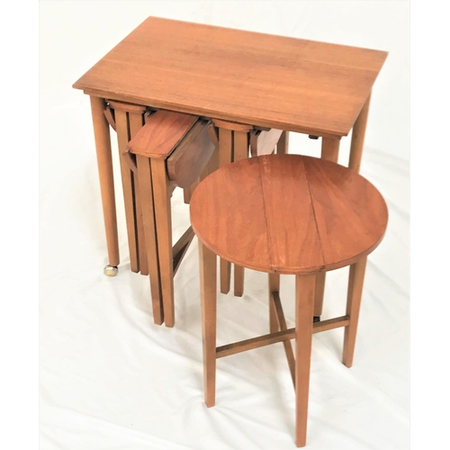 502 - TEAK OCCASIONAL TABLE
with an oblong top standing on turned supports with castors, with four drop fl... 