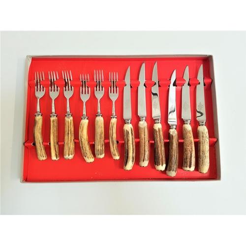 180 - SET OF SIX STEAK KNIVES AND FORKS
with horn handles, the blades marked 'Mutual Hiram Wild Sheffield ... 