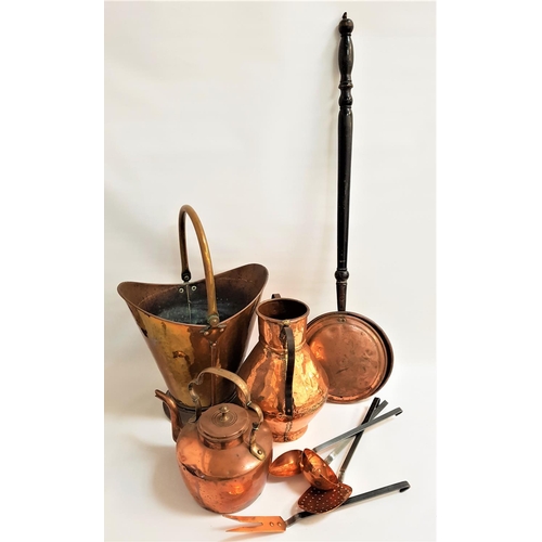 196 - SELECTION OF VINTAGE COPPER WARE
including a helmet coal scuttle with a swing handle, warming pan wi... 