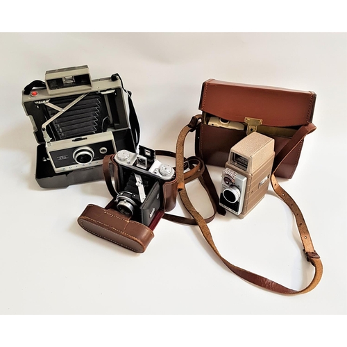 201 - SELECTION OF PHOTOGRAPHIC CAMERAS
including a cased Polaroid Automatic 330 Land Camera, a cased Ensi... 