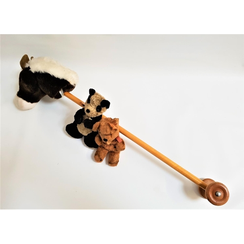 224 - MERRY THOUGHT HOBBY HORSE
with a plush head on a pole with handles and wheels, 90cm long, together w... 