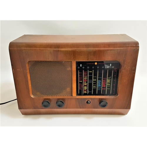 228 - PYE RADIOGRAM 
in a walnut case with a coloured glass tuning panel with dials below, mains operated