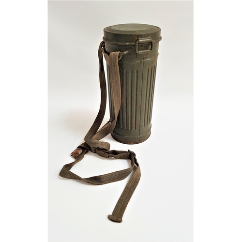 290 - WWII GERMAN GAS MASK CANISTER
of ribbed construction with shoulder strap, 28cm high