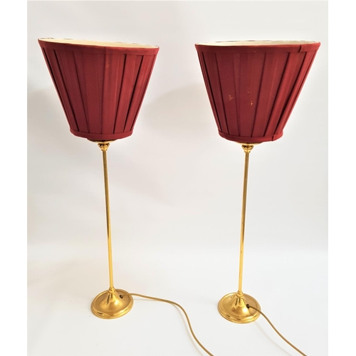 446 - PAIR OF BRASS TABLE LAMPS
raised on circular bases with narrow columns and faux drip pans, each with... 