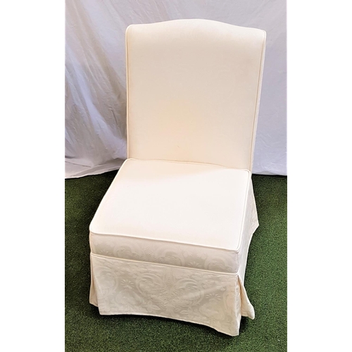 482 - BEDROOM SIDE CHAIR
with a shaped padded back and stuffover seat, standing on squat bun feet, covered... 