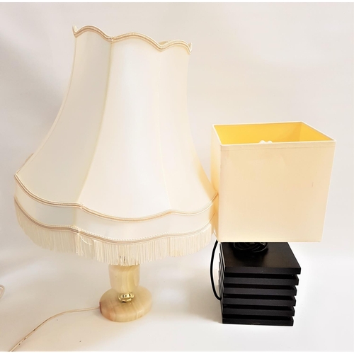 487 - STAINED ASH TABLE LAMP
with a multi layered step carved square base with a cream square shade, 42cm ... 