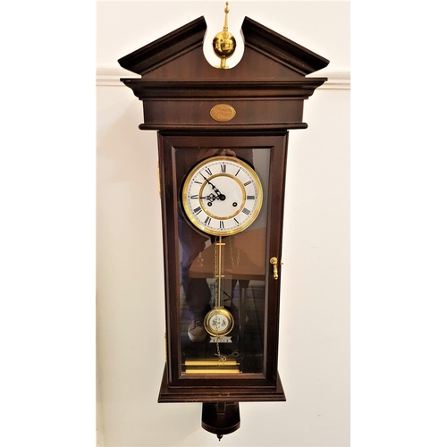 492 - MAHOGANY CASED VIENNA TYPE WALL CLOCK
the circular dial with Roman numerals and twin train and pendu... 