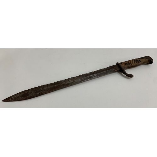 462 - WWI GERMAN SAW BACK BAYONET
with a 36cm long blade, backward quillion and two piece wooden grip