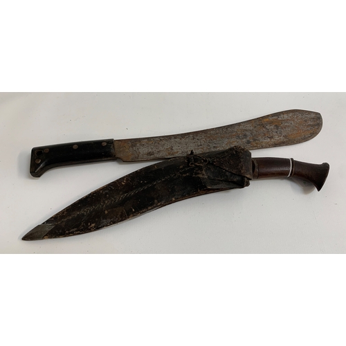 469 - KUKRI KNIFE
with a shaped blade, 31.5cm long, and hardwood handle, together with it's two smaller bo... 