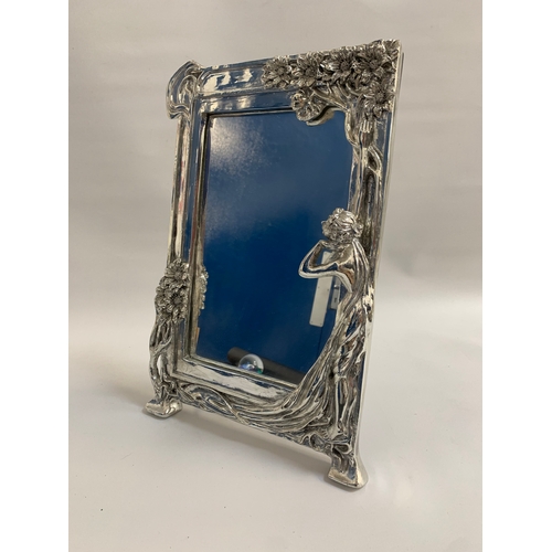 297 - ORNATE ART NOUVEAU STYLE SILVERED MIRROR
the frame made of plaster with a silver finish, decorated w... 