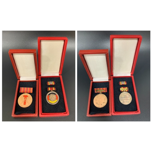 481 - G D R MEDAL OF MERIT
inscribed Verdienstmedaille Der DDR, with bar and box, together with the Honour... 