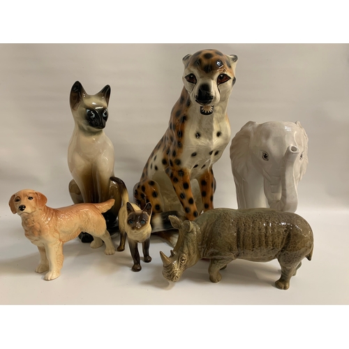 234 - SELECTION OF CERAMIC ANIMALS
including a large leopard, a white elephant stick stand, two Siamese ca... 