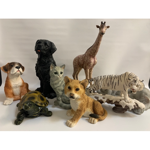 298 - SELECTION OF KITSCH RESIN ANIMAL FIGURES
including a giraffe, 46cm high; a puppy; two cat figures, a... 