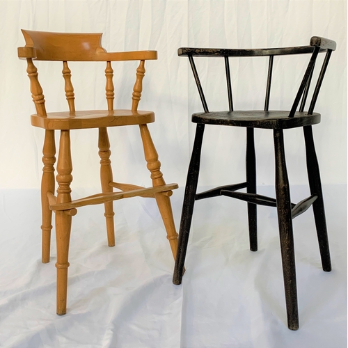 541 - CHILD'S BEECH HIGH CHAIR
with shaped arms and a footrest, standing on turned supports united by a st... 