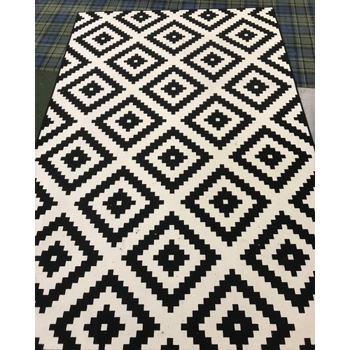 549 - LARGE BLACK AND WHITE RUG
with a geometric pattern, 300cm x 200cm