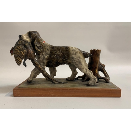 314 - SPELTER SPANIEL RETRIEVING A PHEASANT BIRD MATCH STRIKER/HOLDER
raised on a wooden base, 14cm high