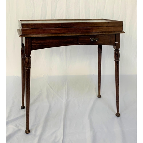 543 - GOTHIC REVIVAL MAHOGANY BIJOUTERIE TABLE
with a fold over glass top above an arched frieze with oppo... 