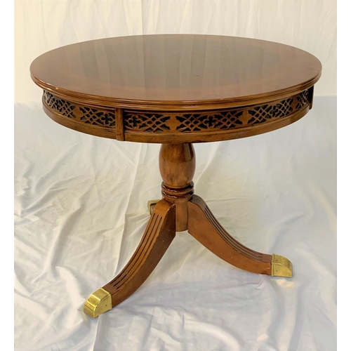 546 - CIRCULAR WALNUT AND CROSSBANDED OCCASIONAL TABLE
with a carved and pierced frieze, standing on a tur... 