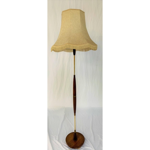 559 - TEAK AND CHROME STANDARD LAMP
raised on a circular base with a shaped teak and chrome column and sha... 