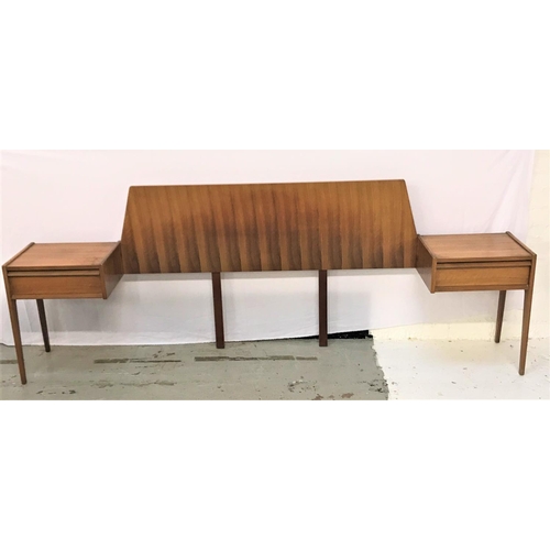 533 - YOUNGER TEAK SHAPED DOUBLE HEADBOARD
with integral bedside shelfs and drawers, standing on shaped su... 