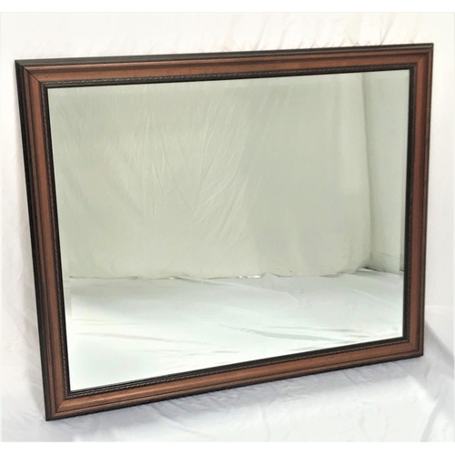 667 - LARGE RECTANGULAR WALL MIRROR
in an oak frame with a bevelled plate, 107cm x 129.5cm