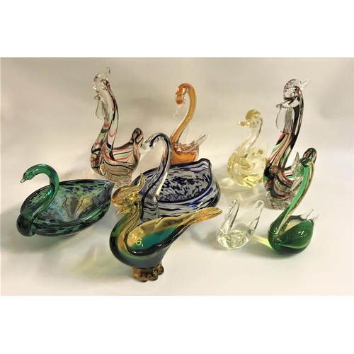 281 - SELECTION OF COLOURFUL GLASS ANIMAL ORNAMENTS
comprising six swans and three cockerels, five with bo... 