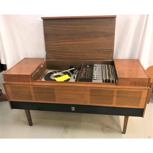 531 - ULTRA MUSIC CENTRE
in a teak case with a central lift up lid revealing a record player and tuner wit... 