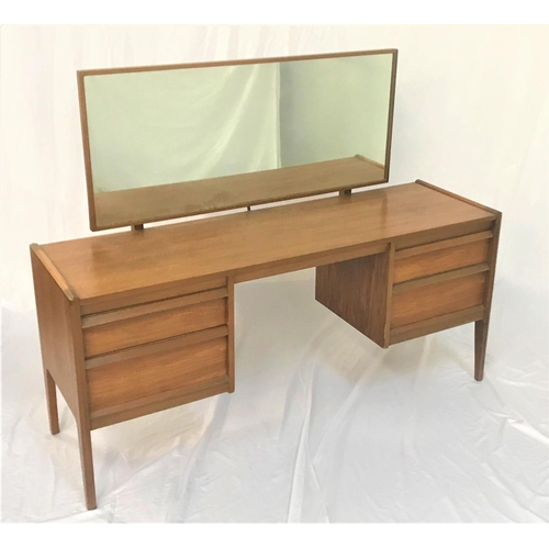 534 - YOUNGER TEAK KNEEHOLE DRESSING TABLE
with an oblong mirror above two pairs of drawers, standing on t... 