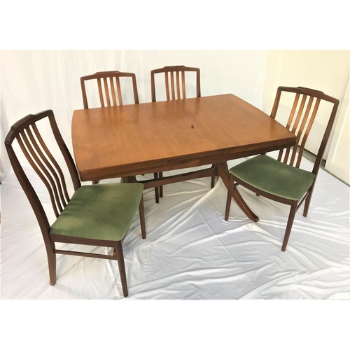 536 - TEAK DRAWLEAF DINNING TABLE
standing on shaped columns with splayed supports united by a stretcher, ... 