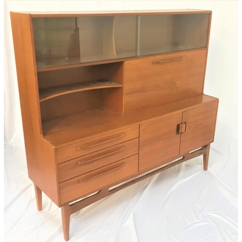 537 - BEITHCRAFT TEAK SIDEBOARD
with a pair of glass sliding upper doors above an open shaped shelf next t... 