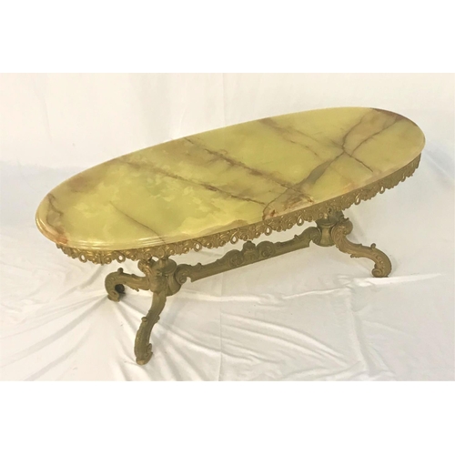 553 - OVAL OCCASIONAL TABLE
with a green onyx marble top on a gilt metal base, 121cm long