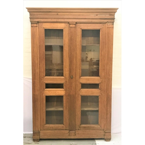 659 - EARLY 19TH CENTURY FRENCH PROVINCIAL OAK ARMOIRE
with a moulded pediment above a pair of paneled gla... 